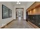 Elegant building hallway with herringbone floors, mailboxes, and artwork at 855 N East St # 302, Indianapolis, IN 46202