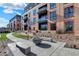 Brick building with courtyard, fire pit, and seating at 855 N East St # 302, Indianapolis, IN 46202