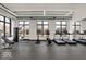 Modern fitness center with various equipment and large windows at 855 N East St # 302, Indianapolis, IN 46202