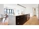 Modern kitchen with island, marble countertops, and stainless steel appliances at 855 N East St # 302, Indianapolis, IN 46202
