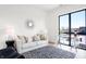 Office space with a couch, window with city view, and modern decor at 855 N East St # 302, Indianapolis, IN 46202