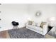 Modern office features a couch, rug, and stylish mirror at 855 N East St # 302, Indianapolis, IN 46202