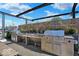 Stainless steel grill and prep station under a pergola at 855 N East St # 302, Indianapolis, IN 46202