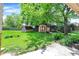 Backyard view showcasing the lawn with sheds at 9157 Neptune Dr, Indianapolis, IN 46229