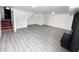 Finished basement featuring grey floors and a fireplace at 9157 Neptune Dr, Indianapolis, IN 46229