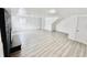 Finished basement with grey floors and fireplace at 9157 Neptune Dr, Indianapolis, IN 46229