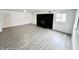 Spacious finished basement with grey floors and fireplace at 9157 Neptune Dr, Indianapolis, IN 46229