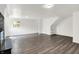 Finished basement featuring gray wood-look flooring, and a bright window at 9157 Neptune Dr, Indianapolis, IN 46229
