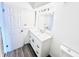 Updated bathroom with a white vanity and marble countertop at 9157 Neptune Dr, Indianapolis, IN 46229