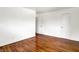 Bedroom featuring hardwood floors, white walls, and two doors at 9157 Neptune Dr, Indianapolis, IN 46229