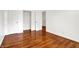 Bedroom featuring hardwood floors, white trim, and a closet at 9157 Neptune Dr, Indianapolis, IN 46229