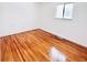 Simple bedroom with hardwood floors and a window at 9157 Neptune Dr, Indianapolis, IN 46229