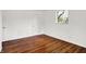 Bright bedroom featuring hardwood floors and a window at 9157 Neptune Dr, Indianapolis, IN 46229