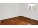 Bright bedroom with hardwood floors and a window providing natural light at 9157 Neptune Dr, Indianapolis, IN 46229