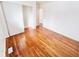 Bedroom featuring hardwood floors and a mirrored closet at 9157 Neptune Dr, Indianapolis, IN 46229