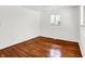 Bedroom with hardwood floors, white walls and trim, and bright natural light at 9157 Neptune Dr, Indianapolis, IN 46229