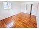 Well-lit bedroom with hardwood floors and double closets at 9157 Neptune Dr, Indianapolis, IN 46229