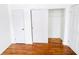 Bedroom with hardwood floors, large closet and door to hallway at 9157 Neptune Dr, Indianapolis, IN 46229