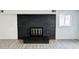 Close-up view of a modern black brick fireplace at 9157 Neptune Dr, Indianapolis, IN 46229
