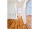 Bright hallway with hardwood floors and access to other rooms at 9157 Neptune Dr, Indianapolis, IN 46229
