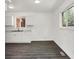 Newly remodeled kitchen with white cabinetry, gray countertops, and updated fixtures at 9157 Neptune Dr, Indianapolis, IN 46229