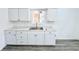 Renovated kitchen with white cabinets and granite countertops at 9157 Neptune Dr, Indianapolis, IN 46229