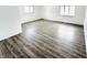 Spacious living room featuring gray vinyl plank flooring and ample natural light at 9157 Neptune Dr, Indianapolis, IN 46229