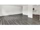 Spacious living room featuring new gray wood-look flooring at 9157 Neptune Dr, Indianapolis, IN 46229