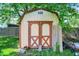 Shed with doors, surrounded by greenery at 9157 Neptune Dr, Indianapolis, IN 46229