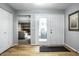 Bright entryway with light hardwood floors and view of living room at 9281 N Temple Ave, Indianapolis, IN 46240