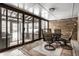 Sunroom with table and chairs, and views of the backyard at 9281 N Temple Ave, Indianapolis, IN 46240