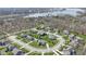 Picturesque aerial view of a suburban neighborhood near a lake, surrounded by lush trees at 11383 Sea Side Ct, Fishers, IN 46040
