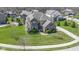 Attractive aerial view of a brick two-story home with manicured lawn and landscaping in a suburban neighborhood at 11383 Sea Side Ct, Fishers, IN 46040