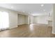 Finished basement featuring light wood floors and a walk-out to the backyard at 11383 Sea Side Ct, Fishers, IN 46040