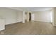 Spacious finished basement featuring durable wood-look floors and neutral paint palette at 11383 Sea Side Ct, Fishers, IN 46040