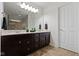 Bathroom featuring a double sink vanity with dark cabinets and tiled floors at 11383 Sea Side Ct, Fishers, IN 46040