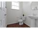 Elegant powder room features a modern pedestal sink and stylish fixtures at 11383 Sea Side Ct, Fishers, IN 46040
