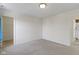 This bedroom has carpeted floors, access to a closet and bathroom, and neutral tones at 11383 Sea Side Ct, Fishers, IN 46040