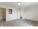 A spacious bedroom with carpet, featuring a poster and closet, offers a blank canvas at 11383 Sea Side Ct, Fishers, IN 46040