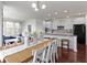 Bright dining area featuring a wood table with white chairs and vases of white flowers at 11383 Sea Side Ct, Fishers, IN 46040