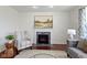 Living room fireplace has mantel, tiled hearth, and stylish decor at 11383 Sea Side Ct, Fishers, IN 46040
