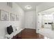 Bright foyer with hardwood floors, neutral decor, and a view into the living area at 11383 Sea Side Ct, Fishers, IN 46040