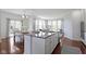 Kitchen island featuring granite countertops and stainless-steel sink at 11383 Sea Side Ct, Fishers, IN 46040