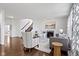 Open-concept living space with hardwood floors and a cozy fireplace at 11383 Sea Side Ct, Fishers, IN 46040