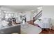 Spacious living room featuring hardwood floors and staircase to upper level at 11383 Sea Side Ct, Fishers, IN 46040