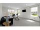 Living room with large windows and neutral carpet at 11383 Sea Side Ct, Fishers, IN 46040