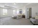 Bright main bedroom featuring tray ceilings, carpet, and large windows for lots of natural light at 11383 Sea Side Ct, Fishers, IN 46040