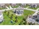 Home showcasing a spacious backyard, with a pool, patio, playground and mature trees at 11383 Sea Side Ct, Fishers, IN 46040