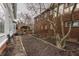 Spacious backyard featuring manicured garden beds and a charming pergola-covered seating area at 1319 N New Jersey St, Indianapolis, IN 46202