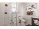 Bathroom with a glass shower and sleek white toilet, modern tiles and finishes for a spa-like experience at 1319 N New Jersey St, Indianapolis, IN 46202
